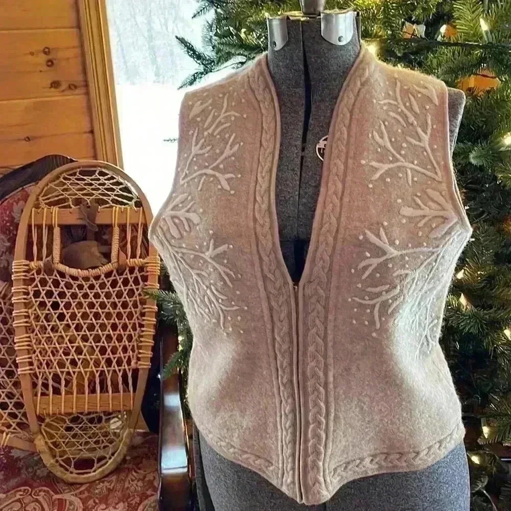 Coldwater Creek women’s 100% wool size medium holiday vest. Zips up the front.